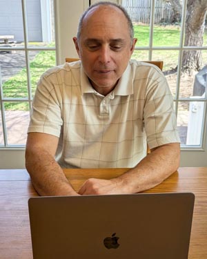 Stuart Brown writing his novel